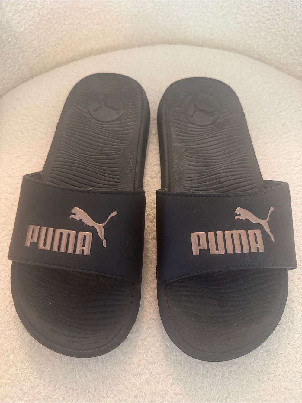 Puma Women’s Black Slides with Metallic Rose Accent